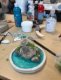 Peinture et mise en couleur de la maquette d'un bassin miniature.